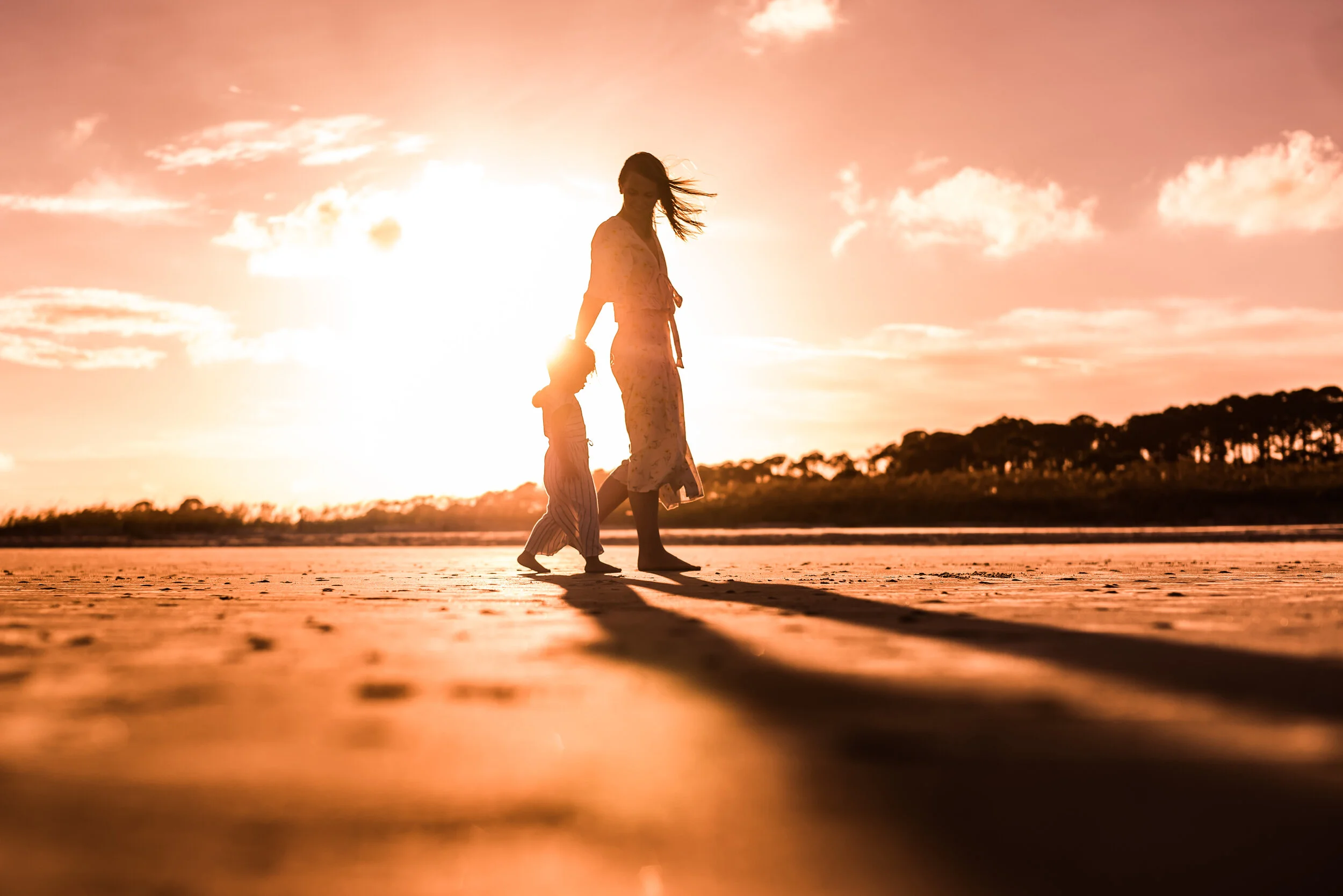 Kids running along the shoreline