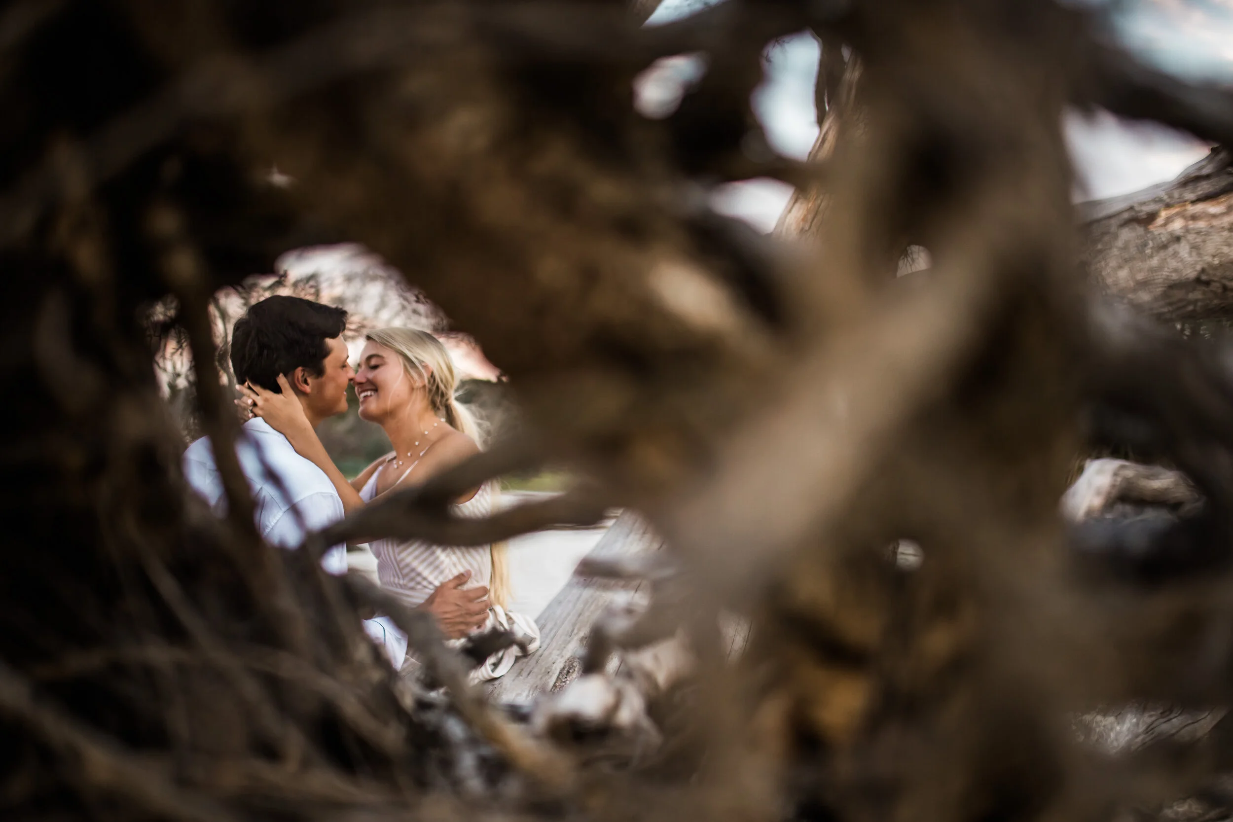 Couple holding each other on the beach